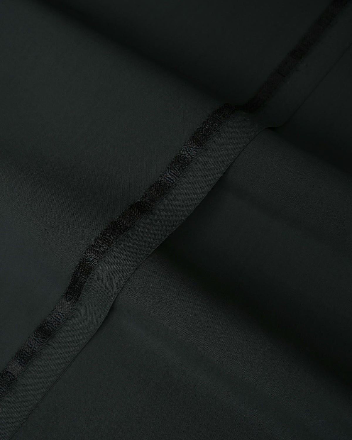 Joyful Comfort Blanket - soft, cozy throw, light blue, folded, on a bed. Image 3 of 10.