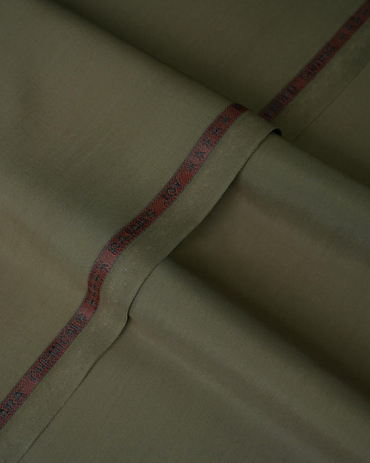Joyful Comfort Blanket, soft cozy throw, cream color, folded on bed.